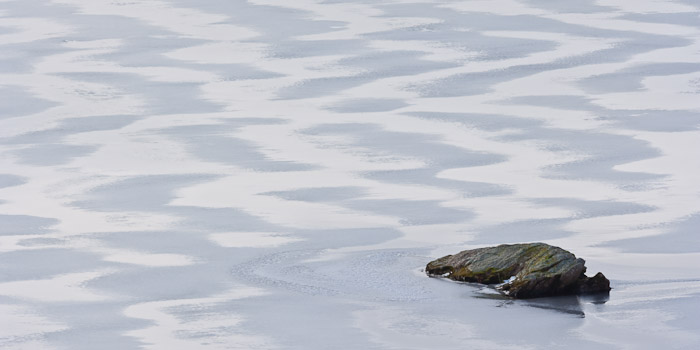 &nbsp;A rock, isolated in a frozen loch, created an interesting counterpoint to the zig zag pattern of the ice.